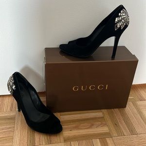 Black suede Gucci peep toe pump with embellishment